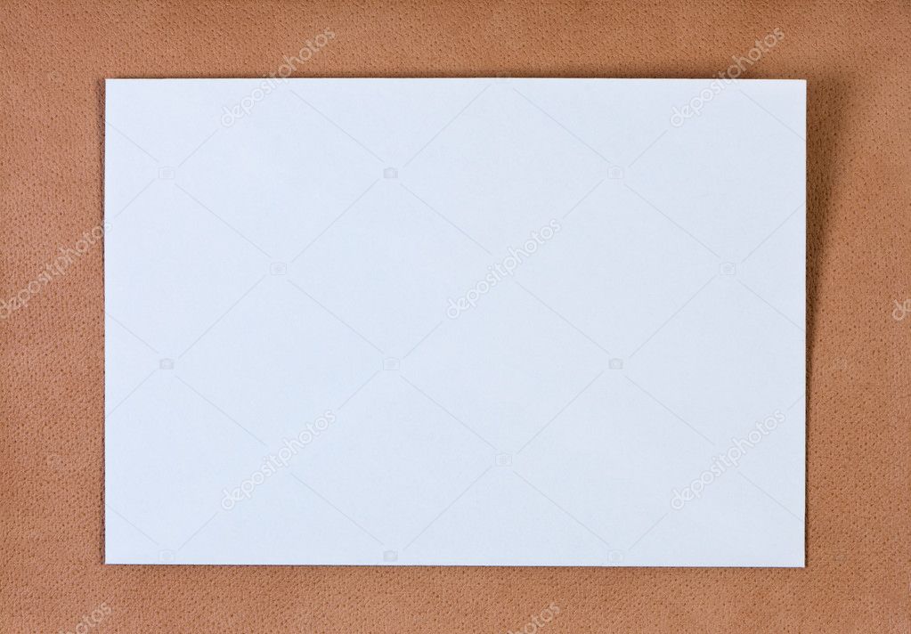 Blank sheet on leather background.