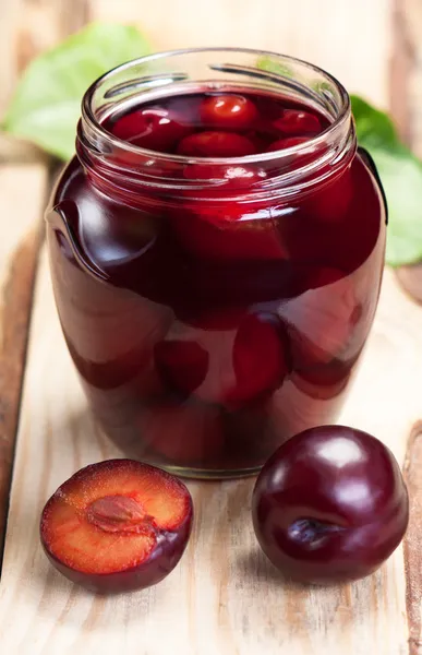 Plum compote in jar. — Stock Photo, Image