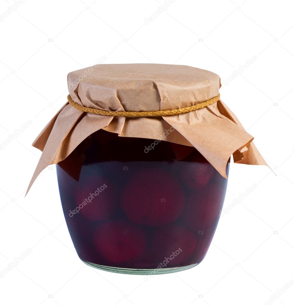 Canned fruit in glass jar on white background.