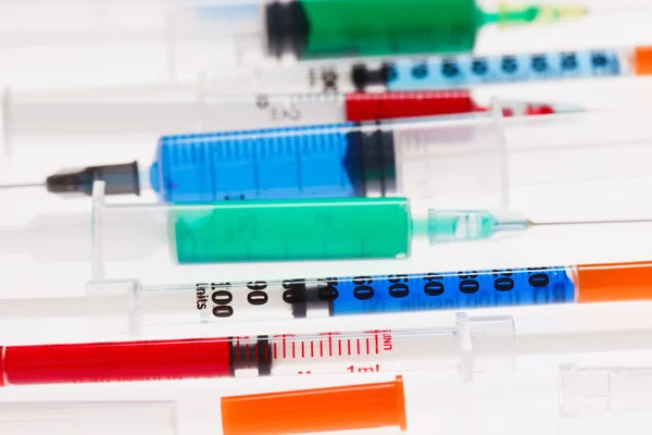 Many multicolor syringes, medical concept still life — Stock Photo, Image