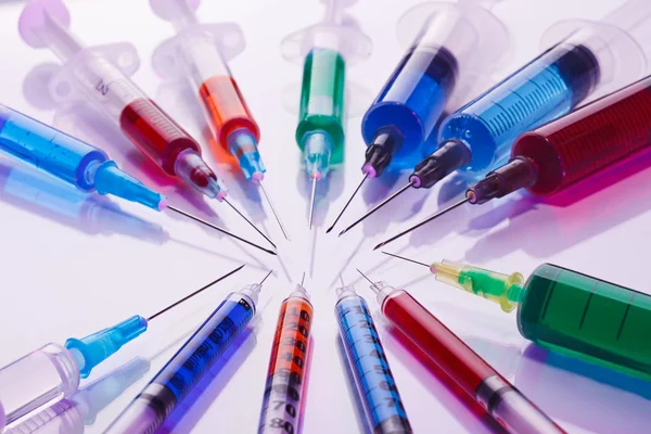 Many multicolor syringes, medical concept still life Stock Picture
