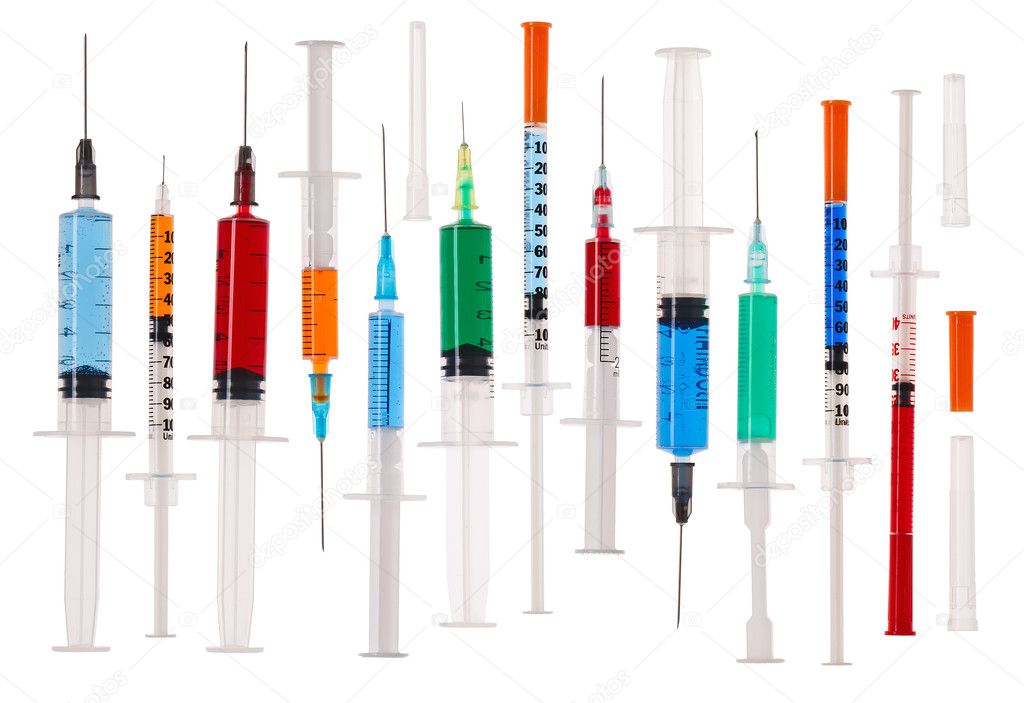 Many multicolor syringes isolated on white