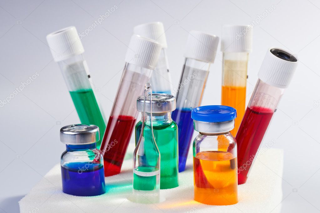 Many multicolor test tubes and bottles medical still life