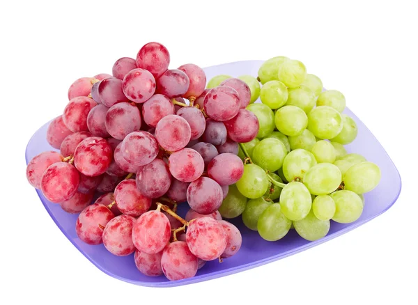 Piros és fehér szőlőt fürtök elszigetelt fehér kék tányéron — Stock Fotó