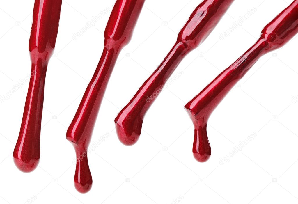 Set of red nail polish brushes and drops isolated on white