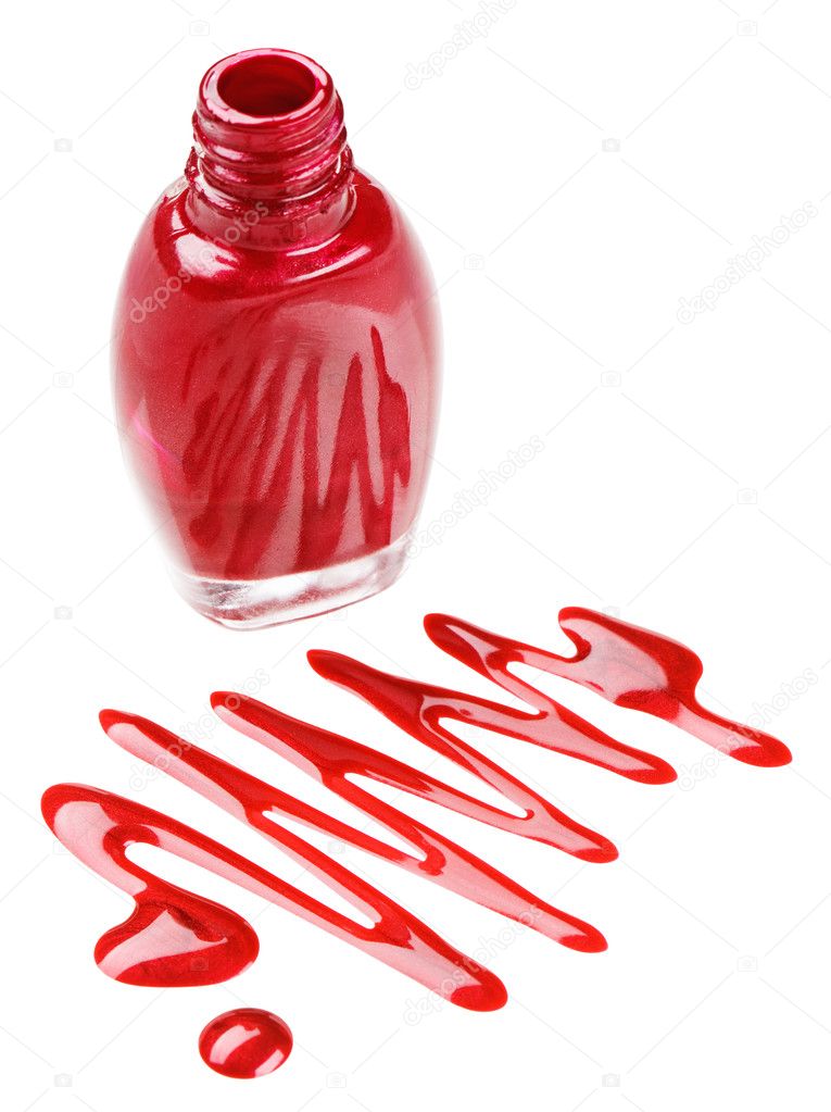 Bottle of red nail polish with enamel drop samples, isolated on