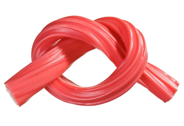 Red gummy candy (licorice) rope, isolated on white closeup view — Stock Photo, Image
