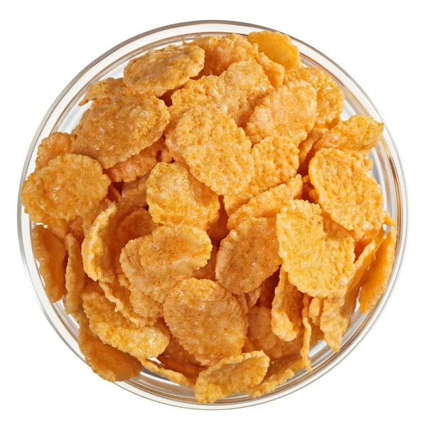 Corn flakes heap in a glass bowl, isolated on white — Stock Photo, Image