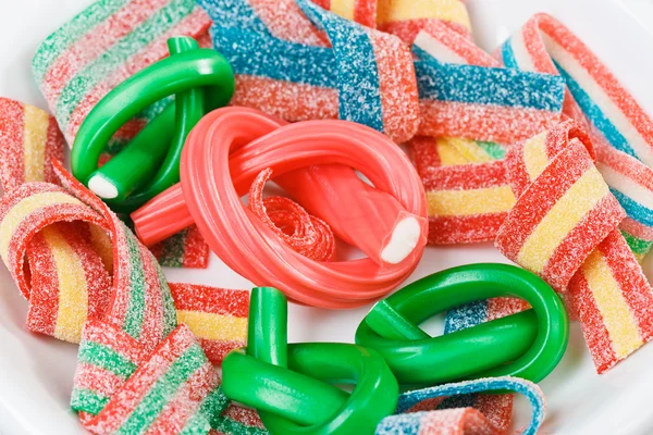 Mehrfarbige Gummibonbons (Lakritze) Süßigkeiten Nahaufnahme Lebensmittel Hintergrund — Stockfoto