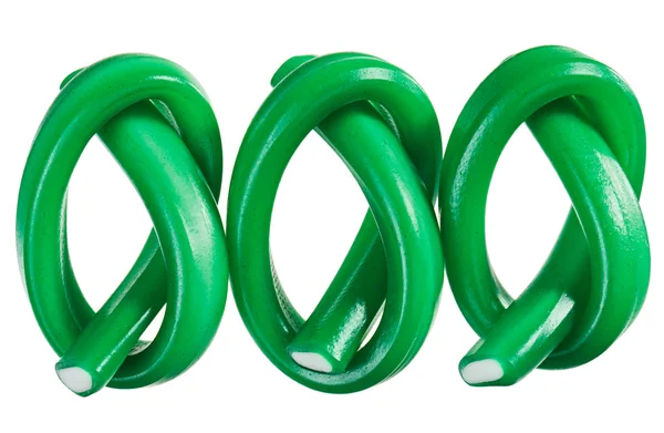 Green gummy candy (licorice) rope set, isolated on white closeup — Stock Photo, Image