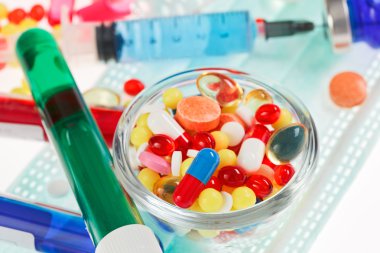 Pills, sterile mask, ampoules and syringe closeup still life, m clipart