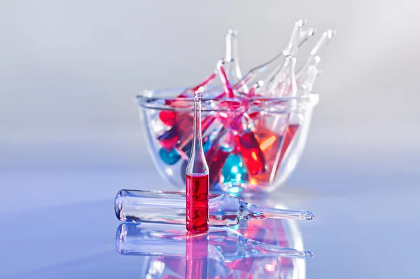 Medical ampules still life in vivid violet colors — Stock Photo, Image
