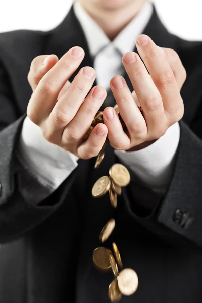 Spilling coins in hands — Stock Photo, Image