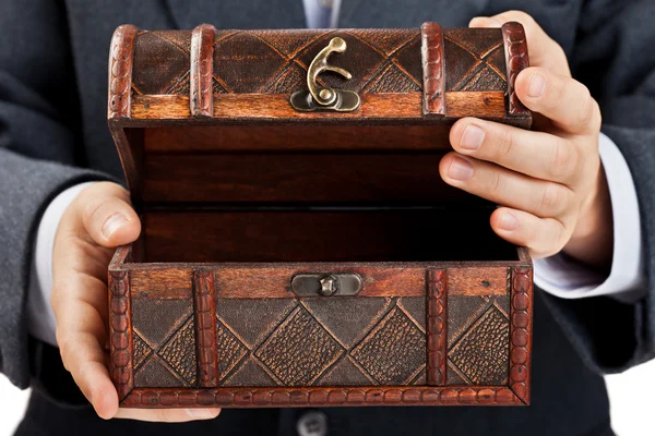 Hand holding treasure chest — Stock Photo, Image