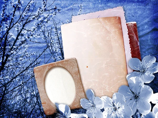 Paper and photo frame with cherry blossoms — Stock Photo, Image