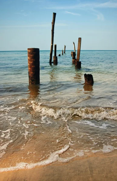 stock image Old jetty pillars in sea