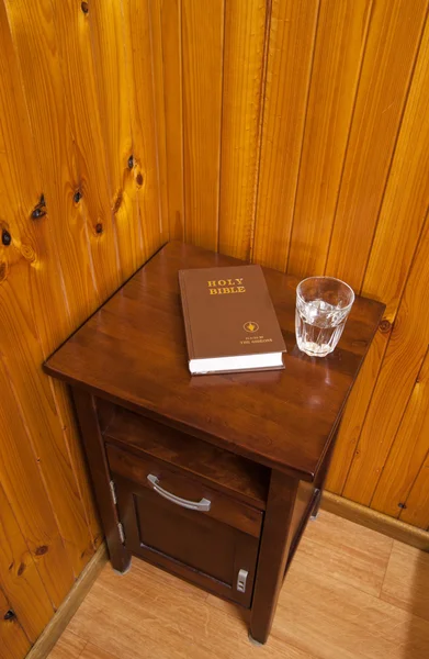 Bible on bed side table — Stock Photo, Image