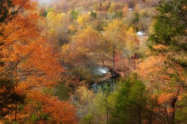 Alley spring mill house in fall clipart