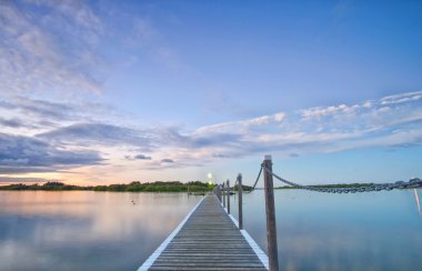 Pontoon jetty across the water clipart