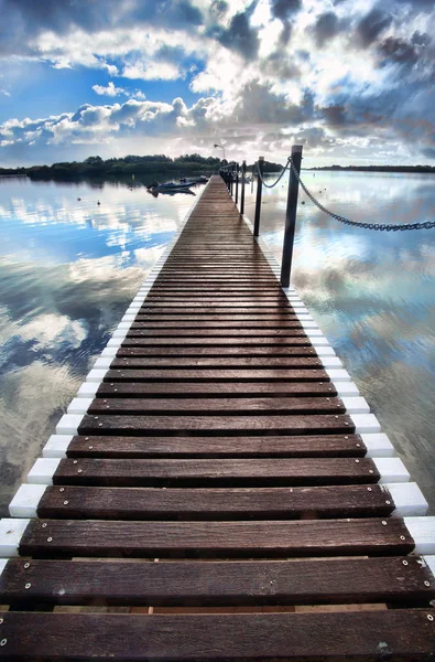 Long pier into water — Stock Photo, Image