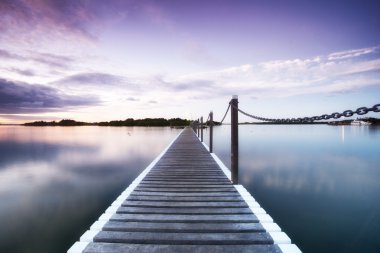 Pontoon jetty across the water clipart