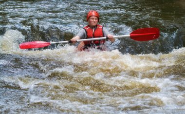 Teenager white water kayaking clipart