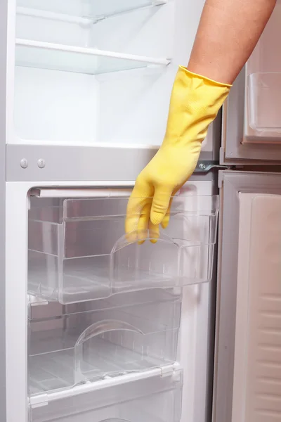 Hand opening refrigerator. Stock Photo