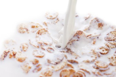 Milk and flakes. clipart