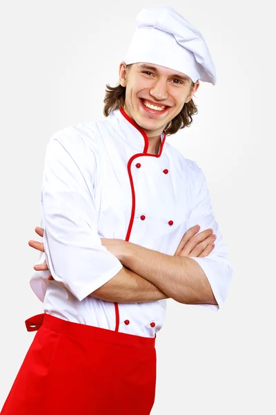 Retrato de um jovem cozinheiro em uniforme — Fotografia de Stock