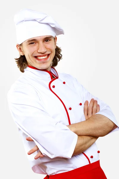 Retrato de um jovem cozinheiro em uniforme — Fotografia de Stock