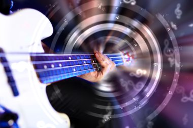 Young guitar player performing in night club clipart