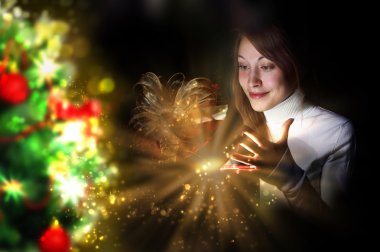 Young woman reading a magic book