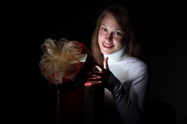 Young woman reading a magic book