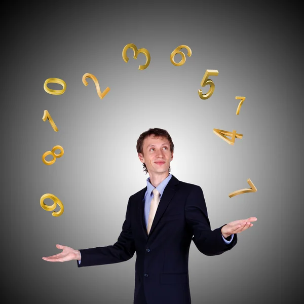 Ділова людина жонглювання з цифрами і символами — стокове фото