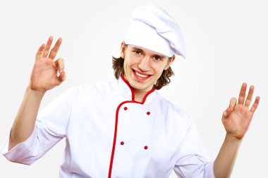 Portrait of a young cook in uniform clipart