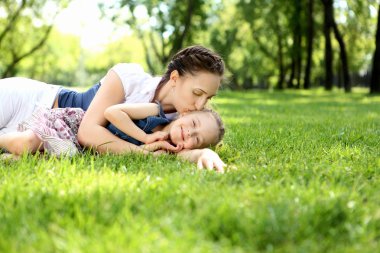 Mother with her daughter outside clipart