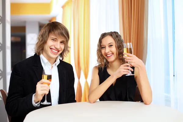 Couple in a restaurant with shampagne — Stock Photo, Image
