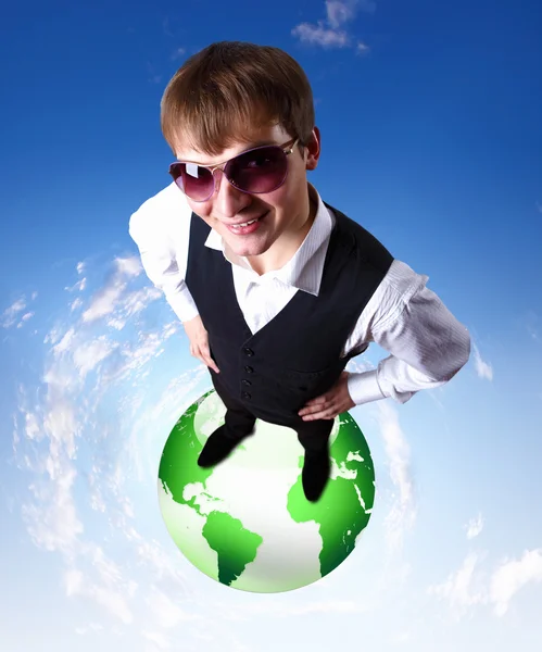 Young businessman and our planet earth — Stock Photo, Image