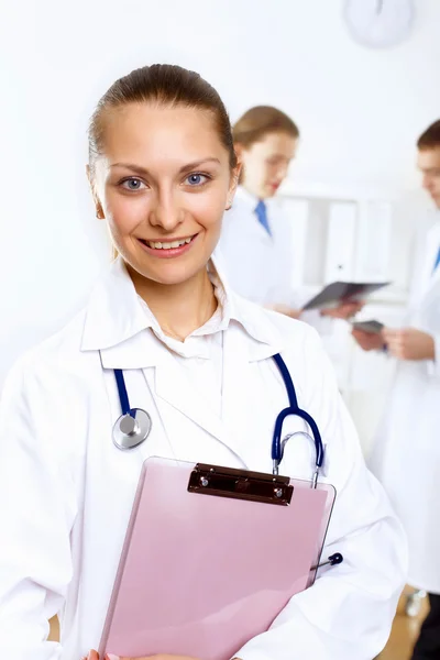 Friendly doctor in medical office — Stock Photo, Image