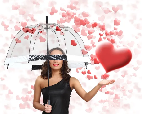 Mujer joven y bonita con paraguas y corazones — Foto de Stock