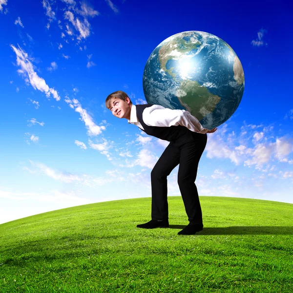 Young businessman carrying world — Stock Photo, Image