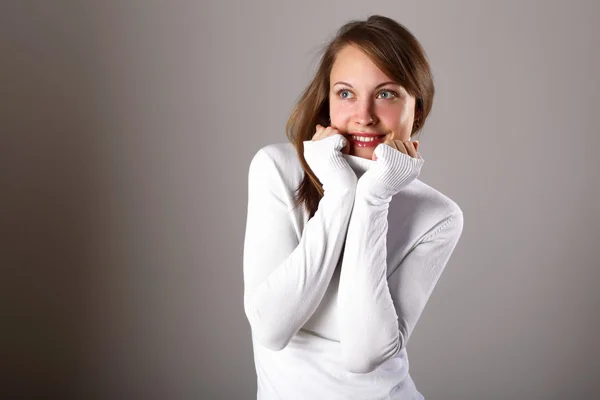 Young girl in white sweater — Stockfoto