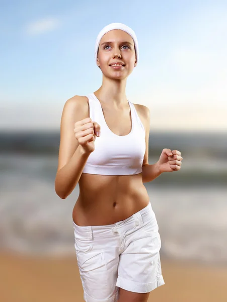 Junge hübsche Frau in Sportkleidung — Stockfoto