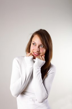 Young girl in white sweater