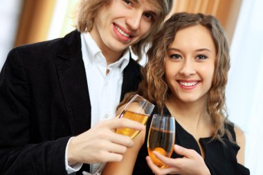 Couple in a restaurant with shampagne clipart