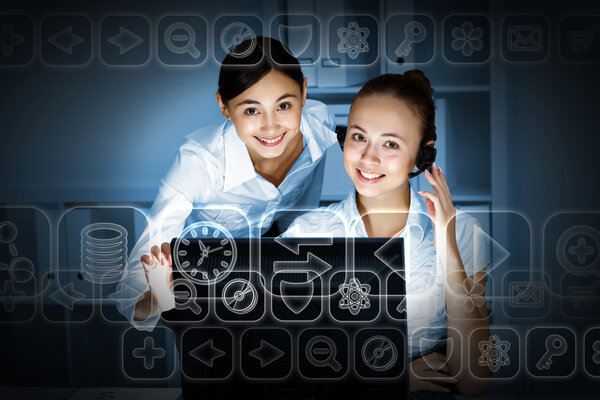 Young woman in business wear and headset