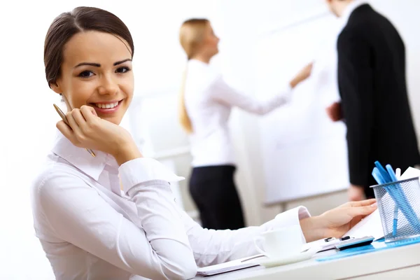 Portrait of a business woman in office Stock Picture