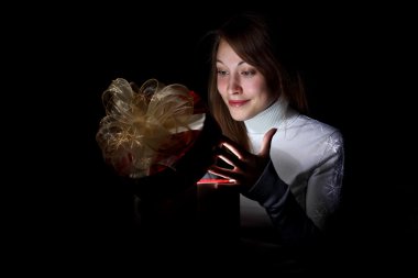 Young woman reading a magic book