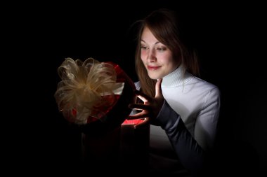 Young woman reading a magic book