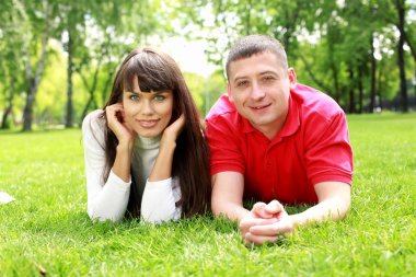 Young couple in the park clipart